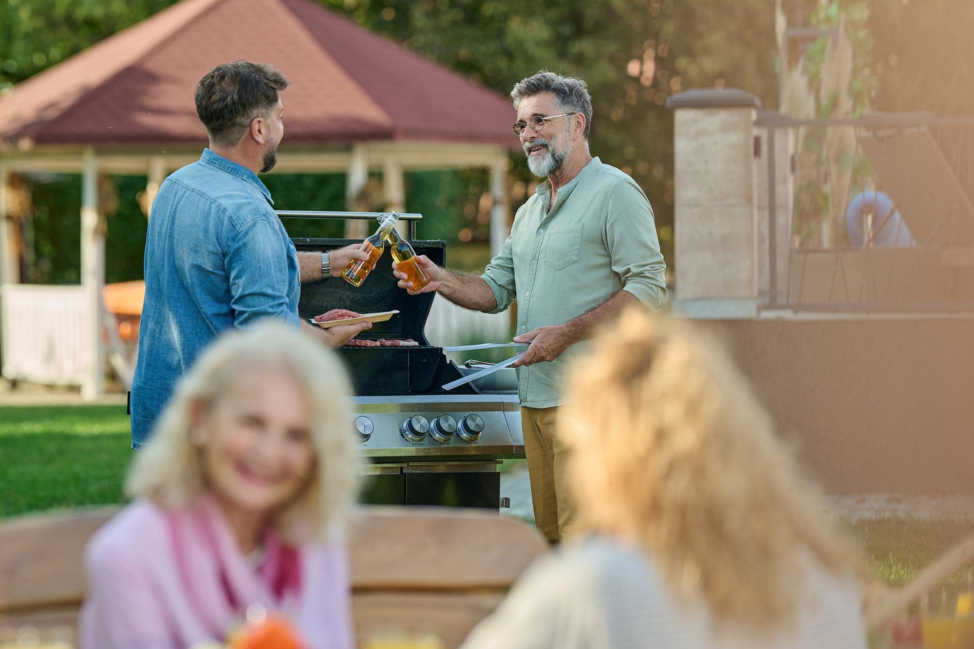 family toasting with bottles of beer at backyard b 2025 04 03 20 42 31 utc scaled